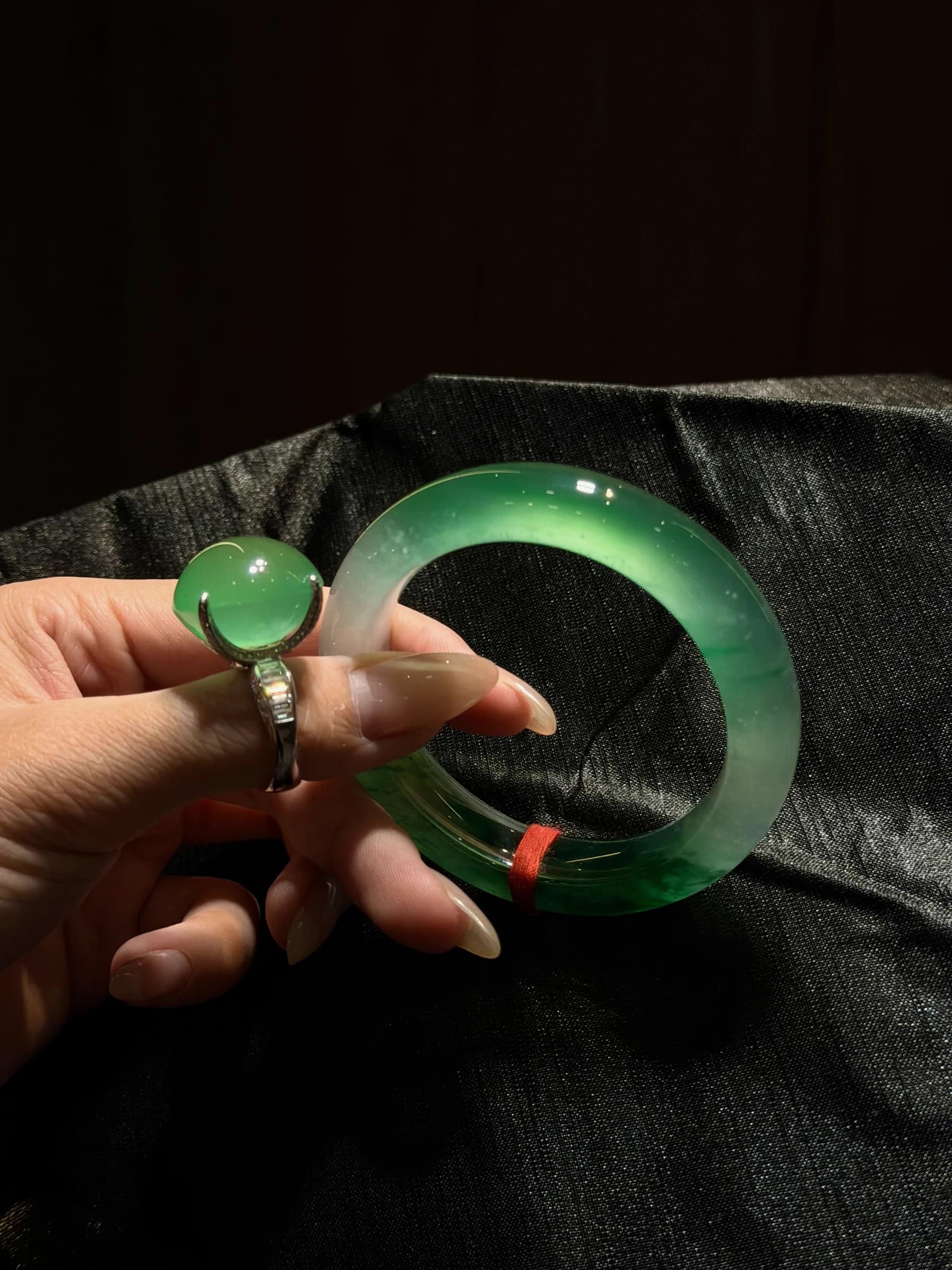 Green jadeite bangle in natural light