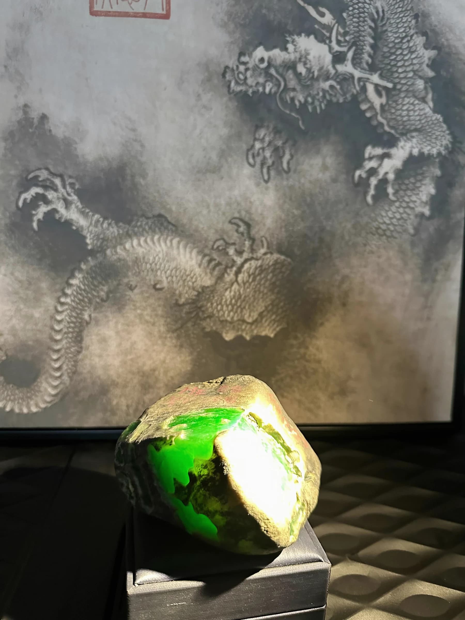 Jadeite rough inspected under light in Ruili